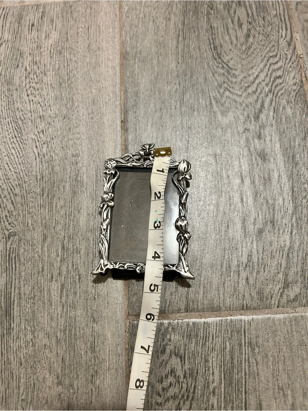 miniature vintage picture frame styled in an intricate Art Nouveau design